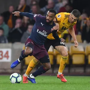 Arsenal's Lacazette Clashes with Wolverhampton's Coady in Premier League Showdown Arsenal's Lacazette Clashes with Wolverhampton's Coady in Premier League Showdown