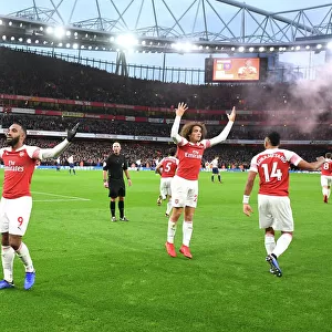 Arsenal's Lacazette, Guendouzi, and Aubameyang Celebrate Goals Against Tottenham in 2018-19 Premier League Match