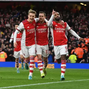 Arsenal's Lacazette, Odegaard, and Cedric Celebrate Goals Against Leicester City (2021-22) Arsenal's Lacazette, Odegaard, and Cedric Celebrate Goals Against Leicester City (2021-22)