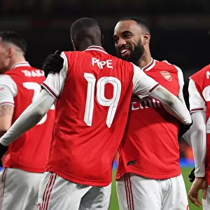 Arsenal's Lacazette and Pepe Celebrate Goal Against Leeds United in FA Cup Third Round