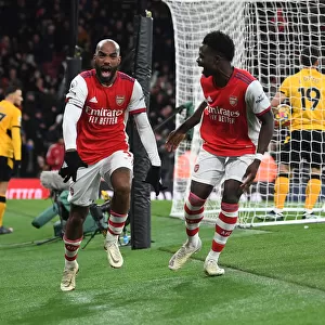 Arsenal's Lacazette and Saka Celebrate Goals Against Wolverhampton Wanderers in Premier League 2021-22