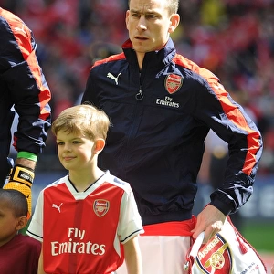 Arsenal's Laurent Koscielny and the Arsenal Mascot Ahead of FA Cup Semi-Final vs. Manchester City