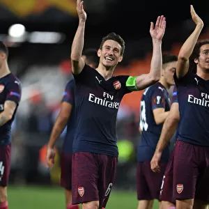 Arsenal's Laurent Koscielny Celebrates with Fans after UEFA Europa League Semi-Final Second Leg against Valencia