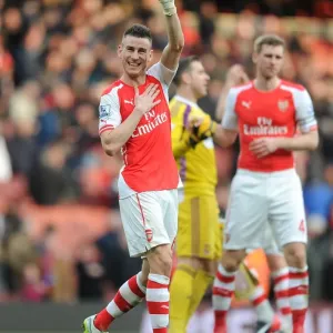Arsenal's Laurent Koscielny Celebrates Goal Against West Ham United in Premier League Match, 2015