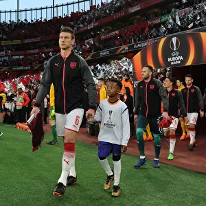 Arsenal's Laurent Koscielny Leads Out Team Against Atletico Madrid in Europa League Semi-Final