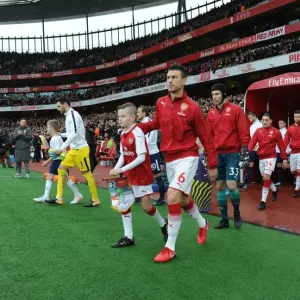 Arsenal's Laurent Koscielny Leads Team Out Against Tottenham in Premier League Clash