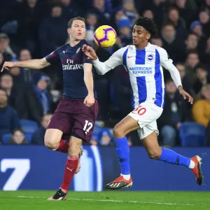 Arsenal's Lichtsteiner Outmaneuvers Brighton's Bernardo in Premier League Clash Arsenal's Lichtsteiner Outmaneuvers Brighton's Bernardo in Premier League Clash