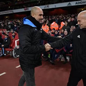 Arsenal's Ljungberg and Guardiola Share a Pre-Match Handshake Ahead of Arsenal vs. Manchester City (2019-20)