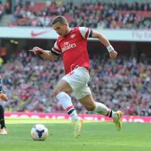 Arsenal's Lukas Podolski in Action Against West Bromwich Albion, Premier League 2013-14 Arsenal's Lukas Podolski in Action Against West Bromwich Albion, Premier League 2013-14