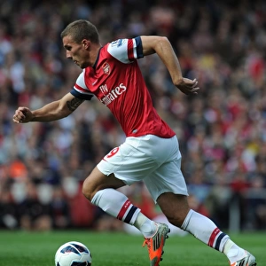 Arsenal's Lukas Podolski Faces Off Against Chelsea in the Premier League