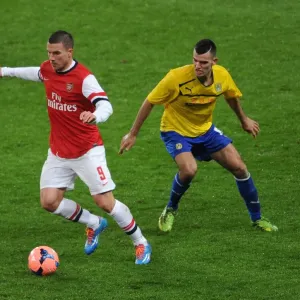 Arsenal's Lukas Podolski Outruns Coventry's Conor Thomas in FA Cup Fourth Round Clash Arsenal's Lukas Podolski Outruns Coventry's Conor Thomas in FA Cup Fourth Round Clash