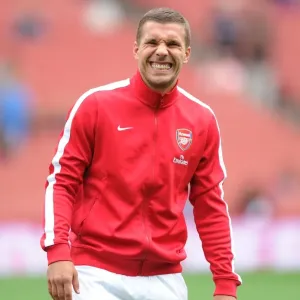 Arsenal's Lukas Podolski Readies for Arsenal v Aston Villa Clash (2013-14 Premier League)