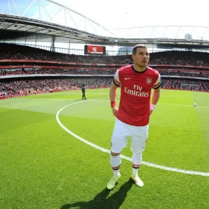 Arsenal's Lukas Podolski Readies for Arsenal v West Bromwich Albion in Premier League (2013-14) Arsenal's Lukas Podolski Readies for Arsenal v West Bromwich Albion in Premier League (2013-14)