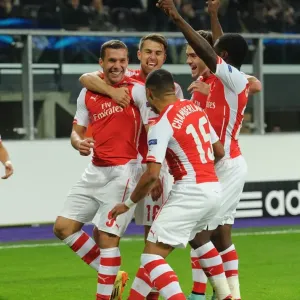 Arsenal's Lukas Podolski Scores and Celebrates with Teammates against RSC Anderlecht in UEFA Champions League, 2014