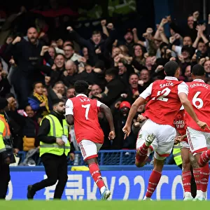 Arsenal's Magalhaes and Saka Celebrate Goal Against Chelsea in 2022-23 Premier League