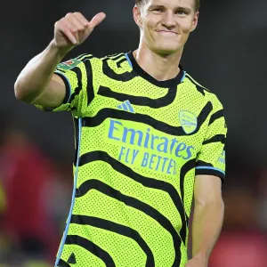 Arsenal's Martin Odegaard Acknowledges Fans after Brentford Cup Victory (2023-24)