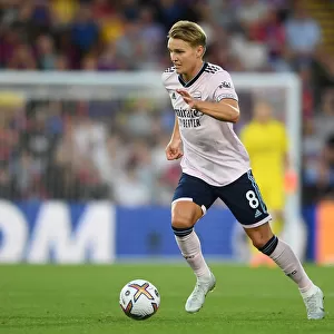 Arsenal's Martin Odegaard in Action: Battle Against Crystal Palace in 2022-23 Premier League