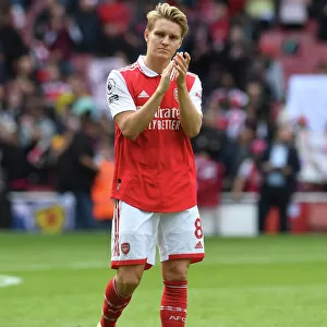 Arsenal's Martin Odegaard Celebrates with Fans after Arsenal vs. Tottenham Match, 2022-23 Premier League