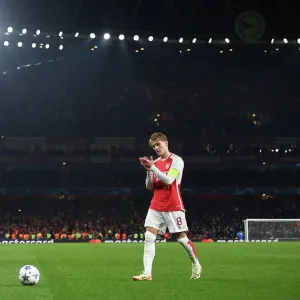 Arsenal's Martin Odegaard Celebrates with Fans vs. RC Lens in 2023-24 UEFA Champions League Arsenal's Martin Odegaard Celebrates with Fans vs. RC Lens in 2023-24 UEFA Champions League