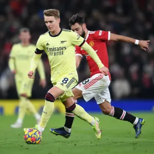 Arsenal's Martin Odegaard Clashes with Manchester United at Old Trafford (Premier League 2020-21) Arsenal's Martin Odegaard Clashes with Manchester United at Old Trafford (Premier League 2020-21)