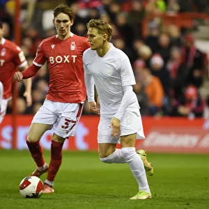 Arsenal's Martin Odegaard Clashes with Nottingham Forest's James Garner in FA Cup Third Round