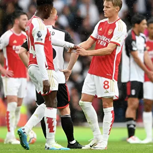 Arsenal's Martin Odegaard and Eddie Nketiah Connect Amidst Premier League Action: Arsenal FC vs Fulham FC (2023-24)