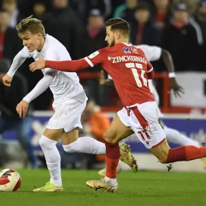 Arsenal's Martin Odegaard Faces Off Against Nottingham Forest's Philip Zinckernagel in FA Cup Third Round