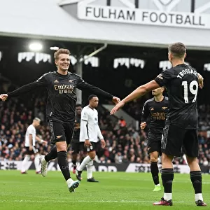 Arsenal's Martin Odegaard and Leandro Trossard Celebrate Their Strikes: A Triumphant Moment at Fulham (2022-23)