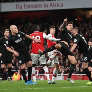 Arsenal's Martinelli Battles Past Brighton's Dunk in Premier League Clash Arsenal's Martinelli Battles Past Brighton's Dunk in Premier League Clash