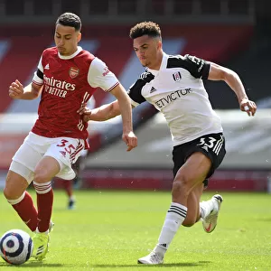 Arsenal's Martinelli Clashes with Fulham's Robinson in Empty Emirates Stadium, Premier League 2020-21