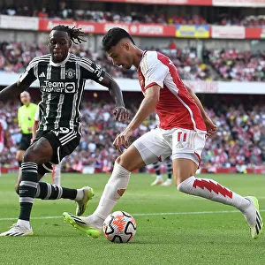 Arsenal's Martinelli Clashes with Manchester United's Wan-Bissaka in 2023-24 Premier League Showdown