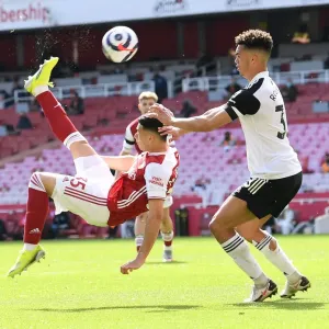 Arsenal's Martinelli Goes for Bicycle Kick Against Fulham in Empty Emirates Stadium