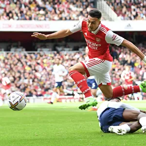 Arsenal's Martinelli Leaps Past Tottenham's Emerson Royal in Premier League Clash