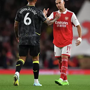 Arsenal's Martinelli and Luiz Share a Moment After Arsenal v Aston Villa Premier League Clash (2022-23)