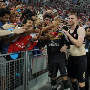 Arsenal's Per Mertesacker Celebrates Victory with Fans in Singapore, 2015