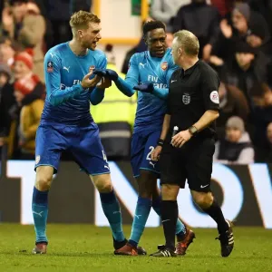 Arsenal's Per Mertesacker and Danny Welbeck Protest Referee's Call during FA Cup Match vs Nottingham Forest Arsenal's Per Mertesacker and Danny Welbeck Protest Referee's Call during FA Cup Match vs Nottingham Forest