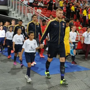 Arsenal's Per Mertesacker Leads Team Out in Arsenal v Singapore XI Match, Kallang, Singapore (July 15, 2015)