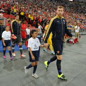 Arsenal's Per Mertesacker Leads Team Out in Arsenal v Singapore XI Match, Kallang, Singapore (July 15, 2015)