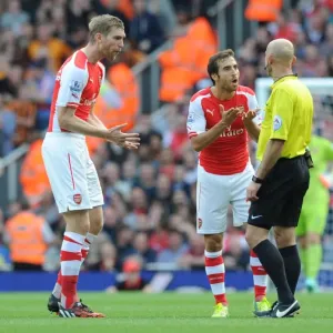 Arsenal's Per Mertesacker and Mathieu Flamini Protest to Referee during Arsenal v Hull City Match Arsenal's Per Mertesacker and Mathieu Flamini Protest to Referee during Arsenal v Hull City Match