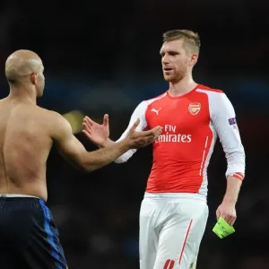 Arsenal's Per Mertesacker Shakes Hands with Monaco's Aymen Abdennour during Champions League Clash Arsenal's Per Mertesacker Shakes Hands with Monaco's Aymen Abdennour during Champions League Clash