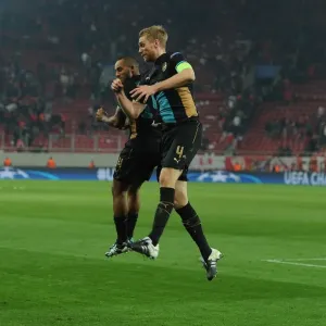 Arsenal's Per Mertesacker and Theo Walcott Celebrate Champions League Victory over Olympiacos Arsenal's Per Mertesacker and Theo Walcott Celebrate Champions League Victory over Olympiacos
