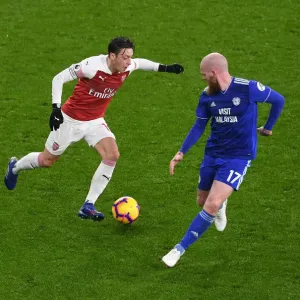 Arsenal's Mesut Ozil Clashes with Cardiff's Aron Gunnarsson in Premier League Showdown Arsenal's Mesut Ozil Clashes with Cardiff's Aron Gunnarsson in Premier League Showdown