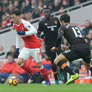 Arsenal's Mesut Ozil Faces Off Against Hull City's Andrea Ranocchia in Premier League Clash