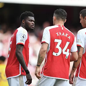 Arsenal's Midfield Trio: Partey, Xhaka, and Kiwior in Action against Wolverhampton Wanderers (2022-23)