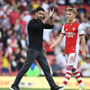 Arsenal's Mikel Arteta Celebrates with Fans After Victory over Norwich City