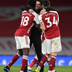 Arsenal's Mikel Arteta Celebrates with Partey and Xhaka after Arsenal vs. Tottenham Premier League Match