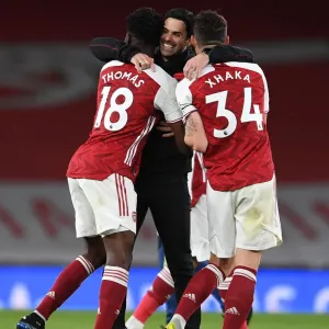Arsenal's Mikel Arteta Celebrates with Partey and Xhaka after Arsenal vs. Tottenham Premier League Match