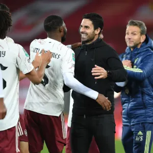 Arsenal's Mikel Arteta Embraces Ainsley Maitland-Niles in Empty Anfield: Carabao Cup Showdown Between Liverpool and Arsenal, 2020-21
