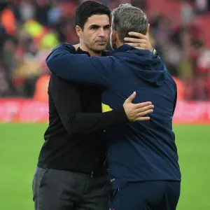 Arsenal's Mikel Arteta Embraces Coach Amidst Premier League Tension: Arsenal FC vs. Nottingham Forest (2022-23)