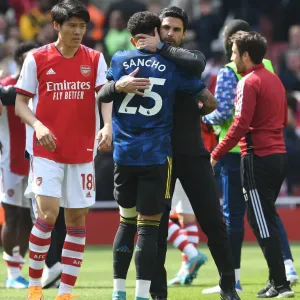 Arsenal's Mikel Arteta Embraces Jadon Sancho in Intense Arsenal v Manchester United Clash (2021-22) Arsenal's Mikel Arteta Embraces Jadon Sancho in Intense Arsenal v Manchester United Clash (2021-22)
